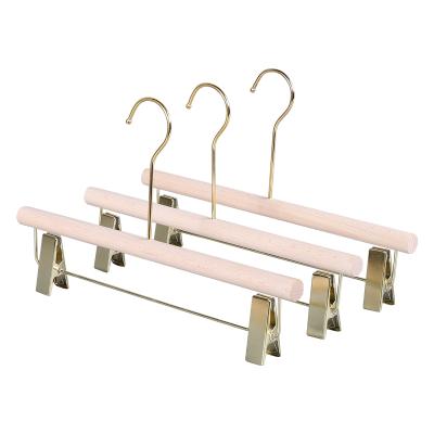 China Durable Luxury Clothing Hanger Natural Wooden Skirt Dress Tie Hanger Pants With Gold Flanges for sale