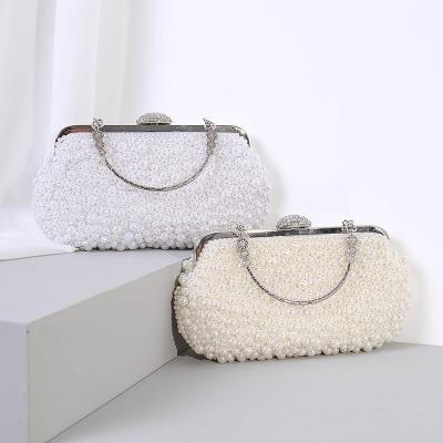 China 2021 new minimalist folder style pillow shape evening clutch dinner bag with pearl decoration for sale