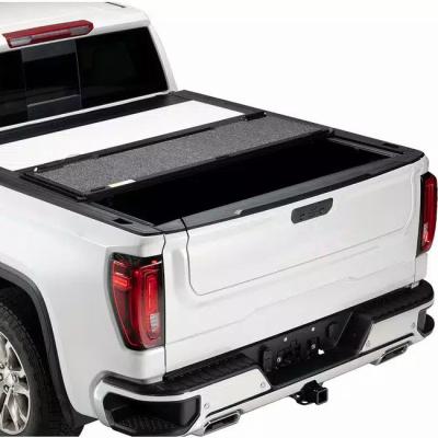 China Retractable Tonneau Cover Professional Customized Aluminum Top Selling Waterproof And Dustproof Black Triple Hard Cover For Toyota Hilux for sale