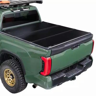 China China Wholesale Tonneau Retractable Cover Fast Delivery Powder Coated Aluminum Black No Drilling Hard Triple Cover For Navarre for sale