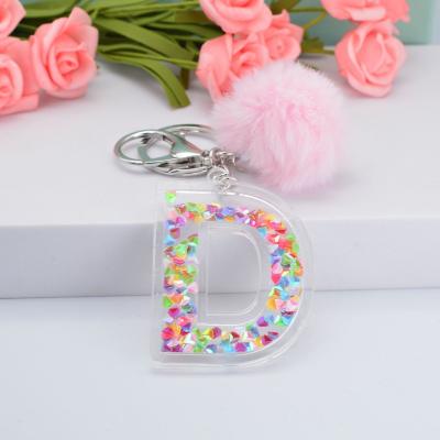 China 2022 Cavity Letter Acrylic Key Chain 26 Key Chains English Ladies Bag Colorful Car Sequin Hairball Ornament Stone Jewelry Pendant for sale