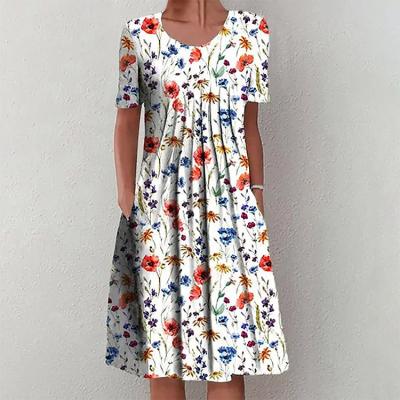 China Breathable Floral Print Casual Dress For Women Summer Crewneck Shorts Sleeve Swing Pleated Midi Dress Beach Party Sunbathing for sale