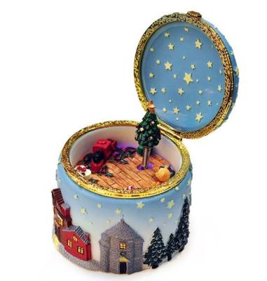 China christmas-themed design resin material round shape christmas scene music box for sale