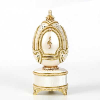 China Music box made of exquisite egg carving 2018 fancy carving decorated with merry goose eggs go round music box for sale