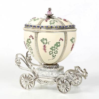 China Music box made of exquisite egg carving pretty hot sale egg carving music box jewelry box pumpkin carriage for sale