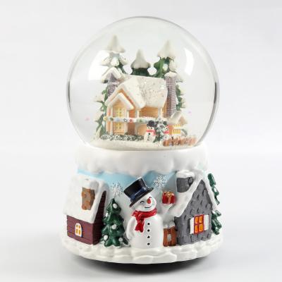 China High quality Christmas gift fashion resin snow globe colorful crystal snow globe music box for sale