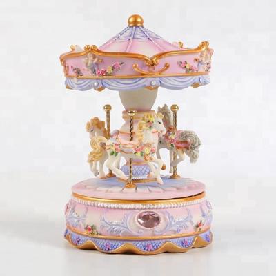 China Happy Romantics Go Around Music Box Fashion Carousel Resin Personalized Pink Music Box for sale