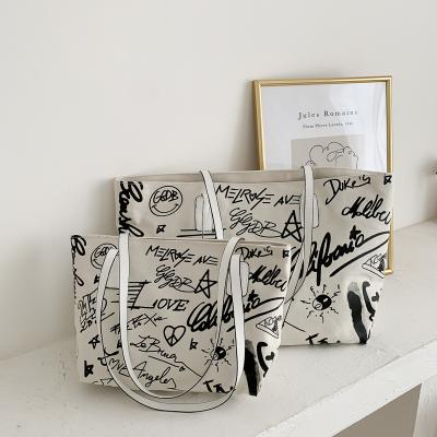 China 2021 Fashion Grafflti Hotsale Ins Street Wear Doodling Writing Printing Cheap Women Shoulder Bags Large Capacity Canvas Tote Bags for sale