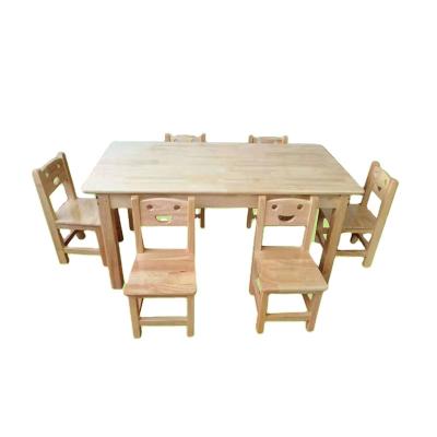 China Nordic Kindergarten Extendable Solid Wood Tables And Chairs Set Smile Shape Child Study Chair Kindergarten Children Furniture for sale