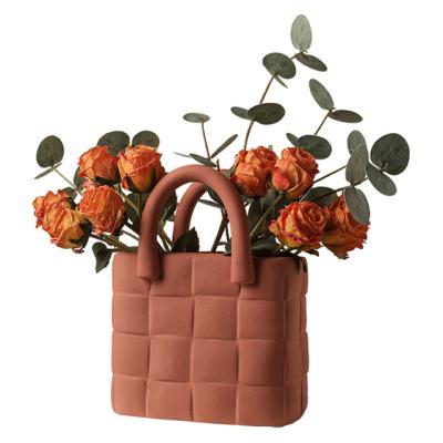 China Minimalist Pemphis Manufacturer Supply Nordic Handbag Design Flower Vases Decoration Luxury Ceramic Vase for sale