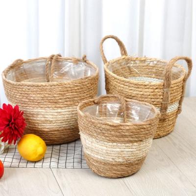 China Stocked Pemphis Hand Make Washable Straw Woven Pastoral Jewelry Toy Storage Basket for sale