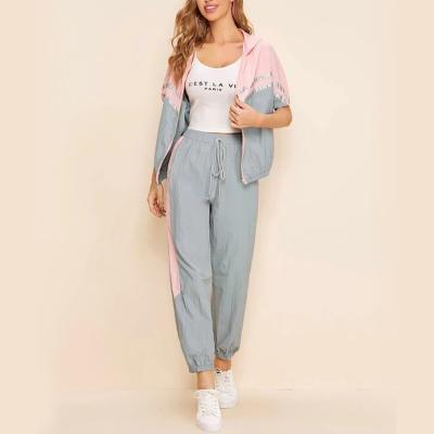 China 2021 Custom Wholesale Private Label 2 Piece Pink Women Breathable Logo Reflect 2 Color Jacket Joggers Set for sale