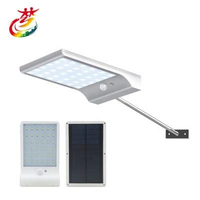 China Traditional Outdoor 50W Solar Street Flood Light Motion Sensor Dusk to Dawn Solar Light with Remote Control IP67 Waterproof for sale