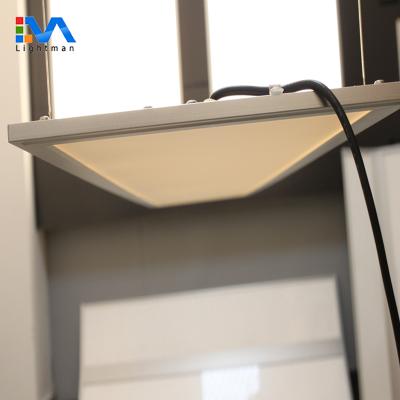 China Suspended led panel light 60w 72w 80w 1200x600 Suspended 70% down light and 30% up light dimmable double sides emitting led panel light for sale