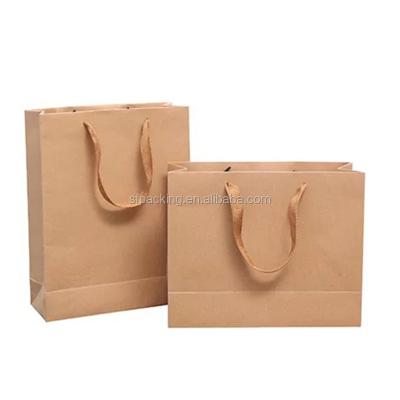 China Recyclable Shopping Package Printed Kraft Paper Bags With Handle for sale