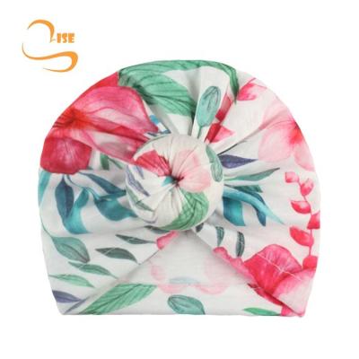 China New Four Seasons children printed flower hat baby ball cap headdress donut newborn hood hat for sale