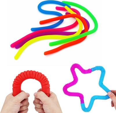 China Nice rubber even fidgety person for kid miniature toys design tube sensory toy for sale