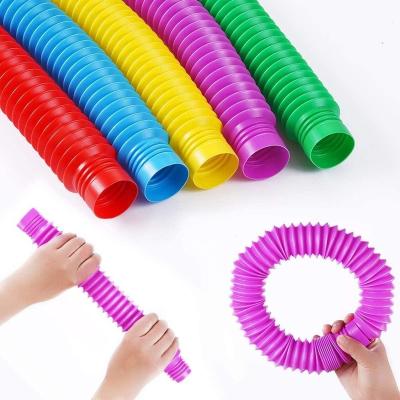 China Unicorn Colorful Pop Tubes Fidget Liquid Filled Toys Wholesale Fridge Rings PP Magic Glitter Finger Rings for sale