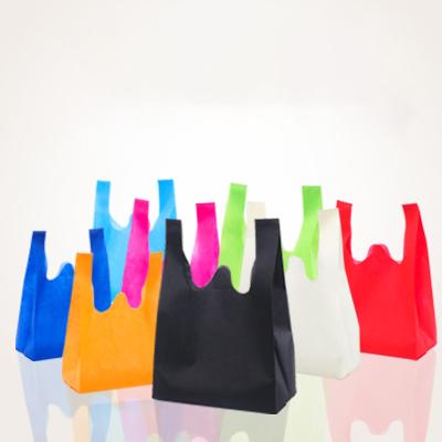 China Eco-friendly Wholesale Nonwoven Portable Vest Bag Folding Supermarket Shopping Tote Bag for sale