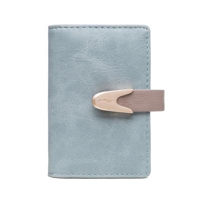 China Hot Selling Frosted PU Buckle Multi-card Slot Card Bag Custom Small Women Water Proof Wallets New Mini for sale