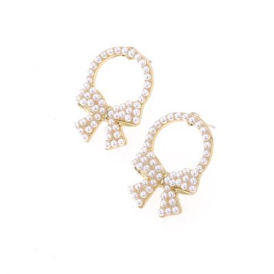 China Fashionable Wholesale Beautiful Girls Earrings Pave Pearl Bow Stud Earrings for sale