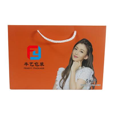 China Handmade Custom Retail Packaging Bag Shopping Gift Bag Clothing Kraft Paper Bags With Handles for sale