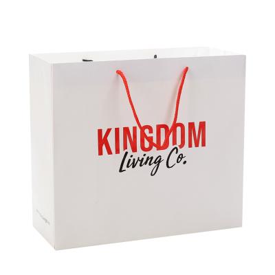 China Recycled Materials White Clothing Shoes Luxury Carrier Custom Logo Printed Shopping Paper Gift Bag With Handle for sale