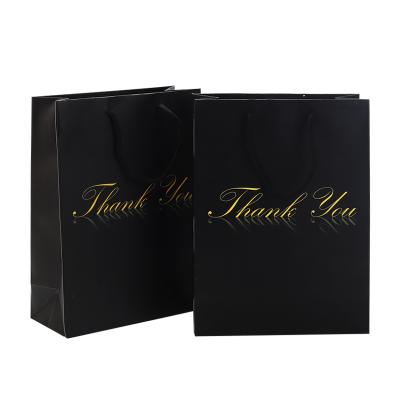 China Recycled Materials Wholesale Custom Printed Black Luxury Gift Shopping Paper Bag With Handle For Clothing for sale