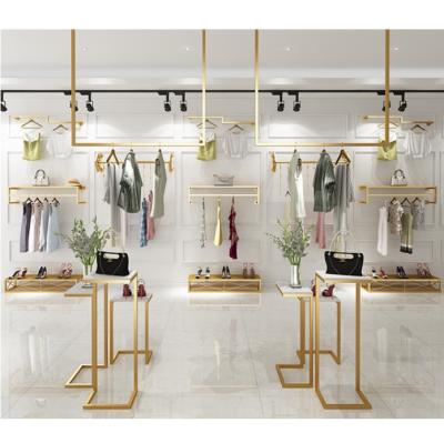 China Europe high-end custom fabric display racks women clothes display racks metal retail boutique gold clothing rack for sale