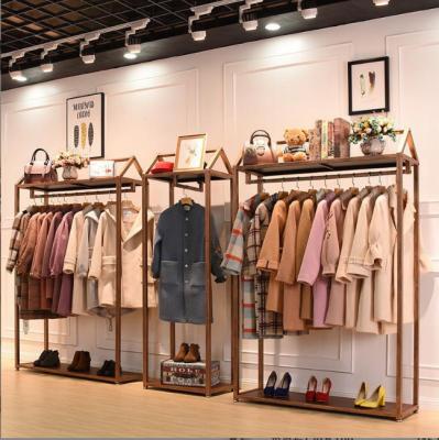 China Europe Customized Wall Mounted Clothes Rack Stainless Steel Clothes Hanging Rack For Clothes Store Display for sale