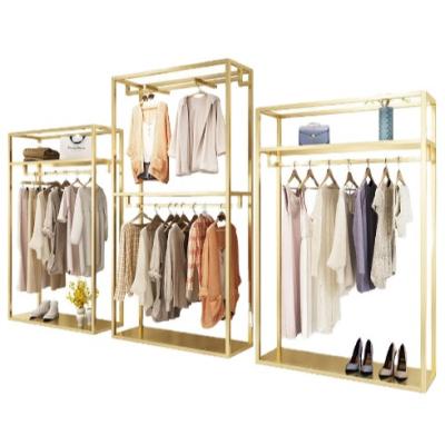 China High Quality Shiny Europe Display Rack Gold Garment Shelf Women Clothing Store Clothes Display Stand for sale