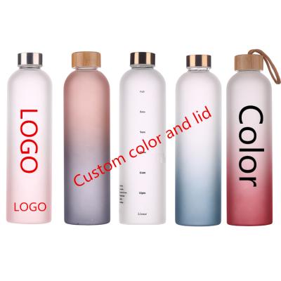 China Custom Frosted Colored Stocked Borosilicate Glass Water Bottle Metal Lid With Time Marker for sale