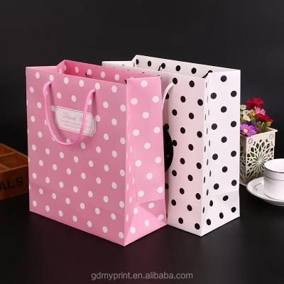 China Recyclable Twist Handle Wave Point Kraft Paper Bag For Clothing Packaging Shopping Bag for sale