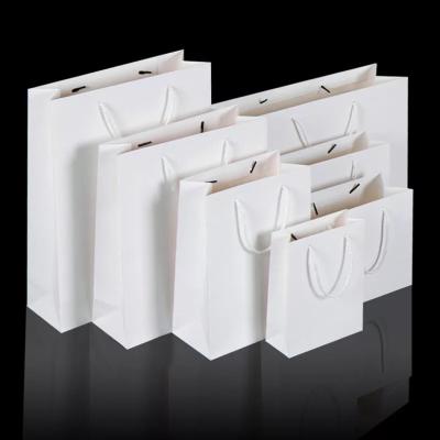 China OEM Recyclable Cheap Plain White Garment Kraft Paper Shopping Paper Bags for sale