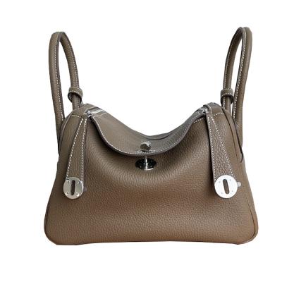 China The first layer used daily luxury Togo whip leather women's bag 2022 Europe and the United States new retro bucket bag fashion handbag for sale