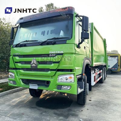 China HOWO 6x4 camión de basura compactador Euro 2 eliminación de residuos descargador trasero de basura camión verde diésel modelo nuevo en venta