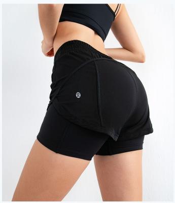 China Breathable Summer Training Fashion Yoga Running Shorts Shorts Women Butt Yoga Lifting Pants With Pockets for sale