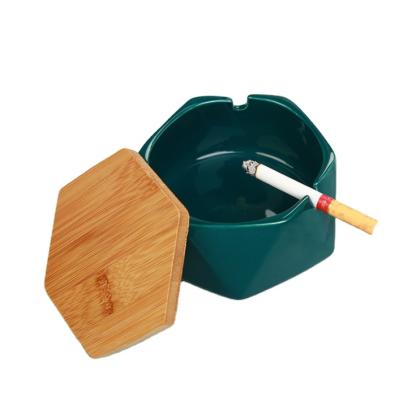 China Modern Ceramic Portable Ashtray Polyhedral Green Portable Ashtray With Bamboo Lid for sale