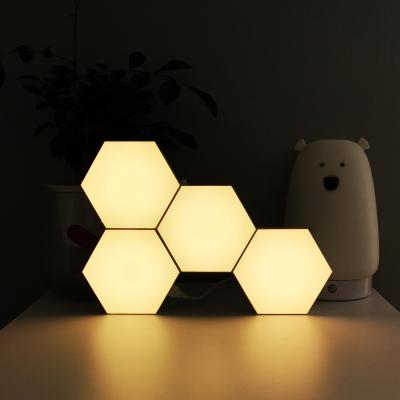 China Newest Kids Gift Modern Voice Control Music Honeycomb Hexagon Christmas Table Light Smart Night Light Projector for sale