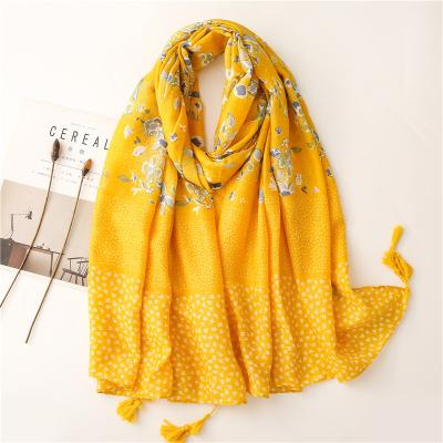 China Wholesale warm viscous high quality bright yellow flower printed cotton shawl soft touch feeling fashion ladies cotton tassels scarves autumn color for sale