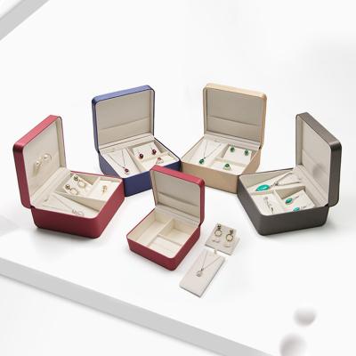 China Newest PU Leather Jewelry Packaging Gift Box in MOQ Stock Petty Packing Box for Ring Necklace Pendant for sale