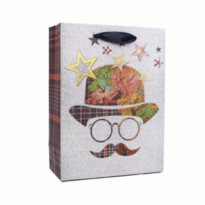 China Recyclable Customized Man Design Color Print Gift Bag Art Paper Gift Bag With Ribbon Handle Direct From Factory for sale