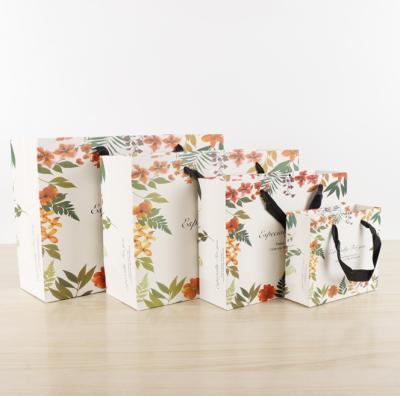 China Amazon Paper Bag Handmade Personalized Customizable Flower Printing Die Cut Paper Cover Paper Luxury Gift Bag With Ribbon Handle for sale