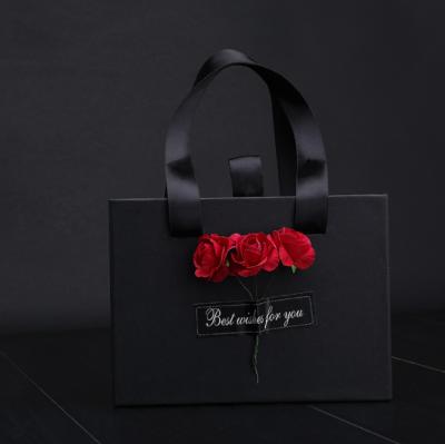 China Design Sale Whole Flower Gift Recyclable Luxury Customized Paper Daily Paper Bag with Ribbon Handle and Dry Flower for sale