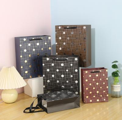 China Dots Design Whole Sale Recyclable Luxury Art Paper Printing Everyday Gift Customized Paper Bag With Ribbon Handle for sale