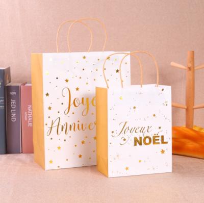 China 2022 New Design Whole Sale Recyclable Cheap Price Customized Kraft Paper Bag Printing Kraft Paper Christmas Gift Bag With Paper Handle for sale