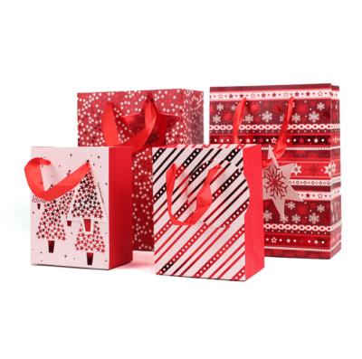 China Christmas Design Recyclable Fashion Customized Red Hot Stamping Art Paper Gift Bag Gift Bag With Ribbon Handle for sale