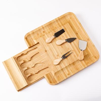 China Sustainable Bamboo Cheese Board with Cheese Tools, Cheese Dish Charcuterie Tray with Utensils Set and 4 Stainless Steel Cutting Knives for sale