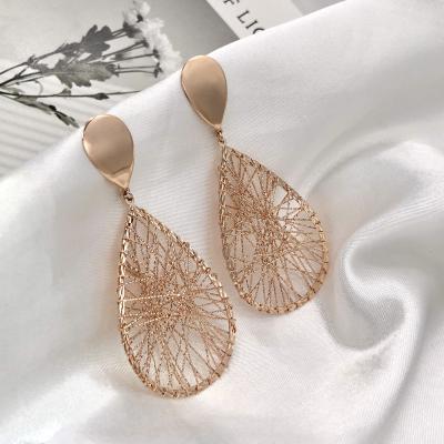 China Real Gold 18K Gold Wire Ladies Oval Hollow Jewelry Large Geometric Drop Earrings TRENDY for sale