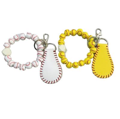 China Europe Monogram Soccer Basketball Sports Wooden Bead Hand Key Chain Printed Flower Wooden Bead Bracelet Keychain for sale